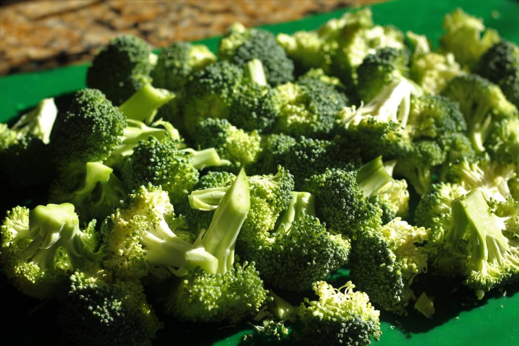 chopped broccoli on a cutting board