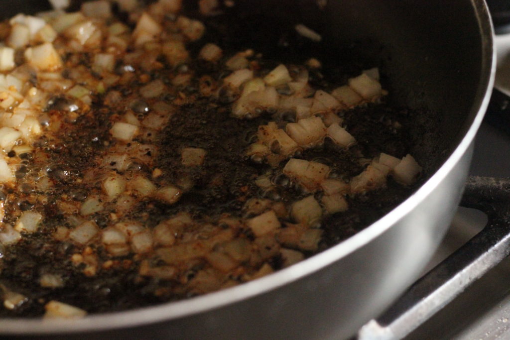 onions cooking in a large skillet