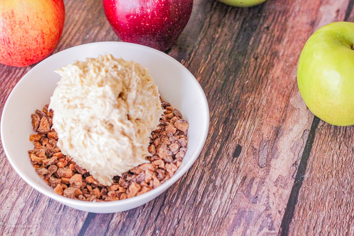 cream cheese ball in a bowl with toffee bits