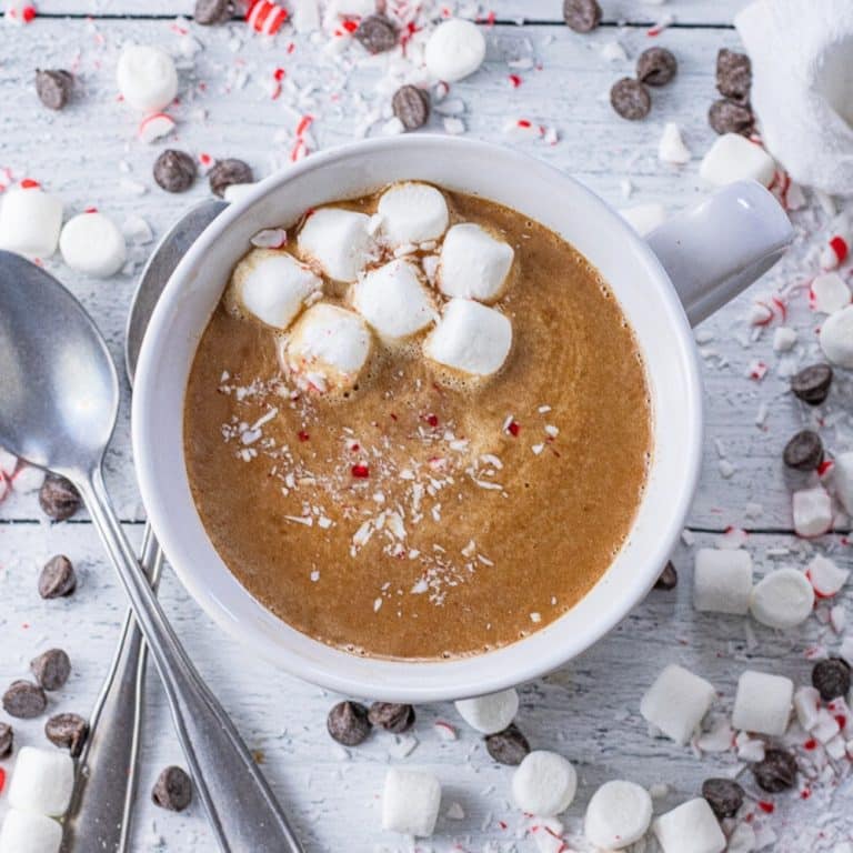 white mug of hot chocolate topped with mini marshmallow