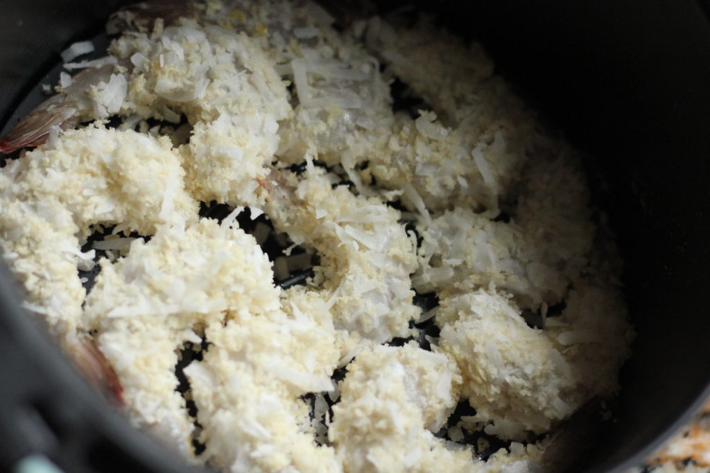 Coconut Shrimp in the pan of an air fryer. 