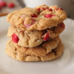 Coconut Chocolate Crunch Cookies image of 4 cookies baked golden brown with m & m's