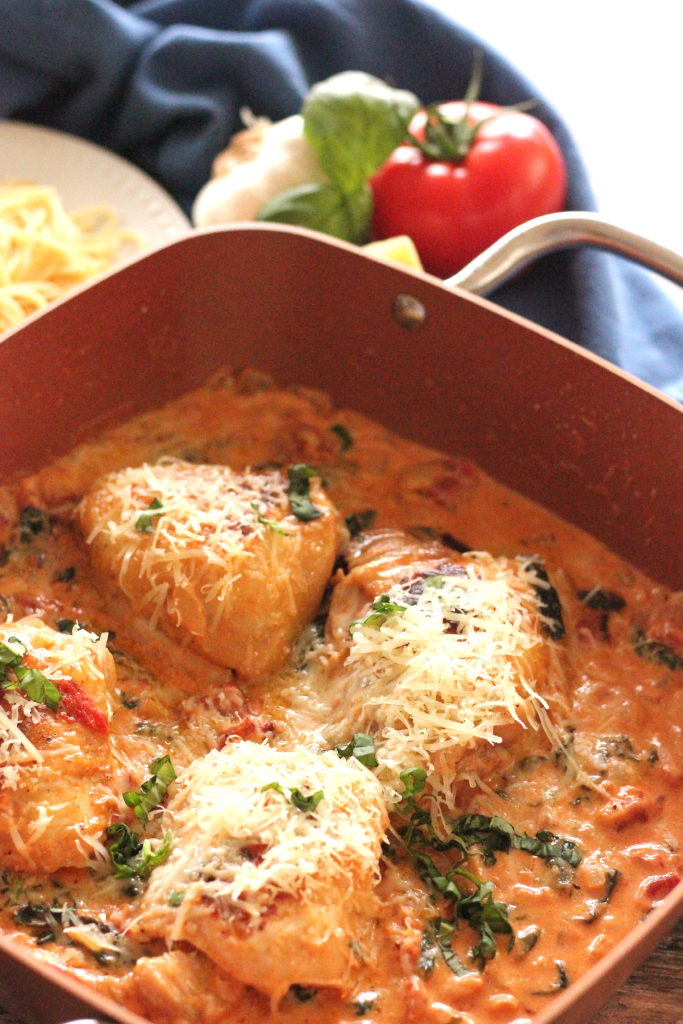 chicken thighs in a creamy tomato spinach sauce