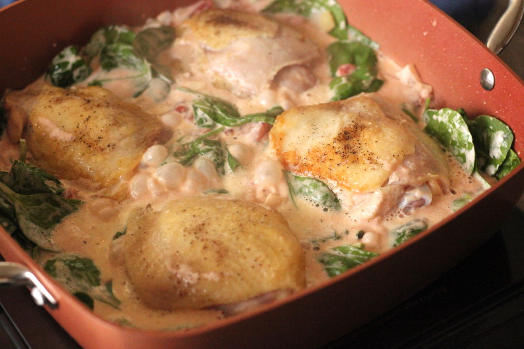 Chicken thighs in a creamy spinach tomato sauce