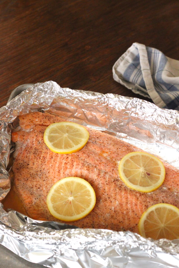 salmon baked in foil, topped with lemon slices