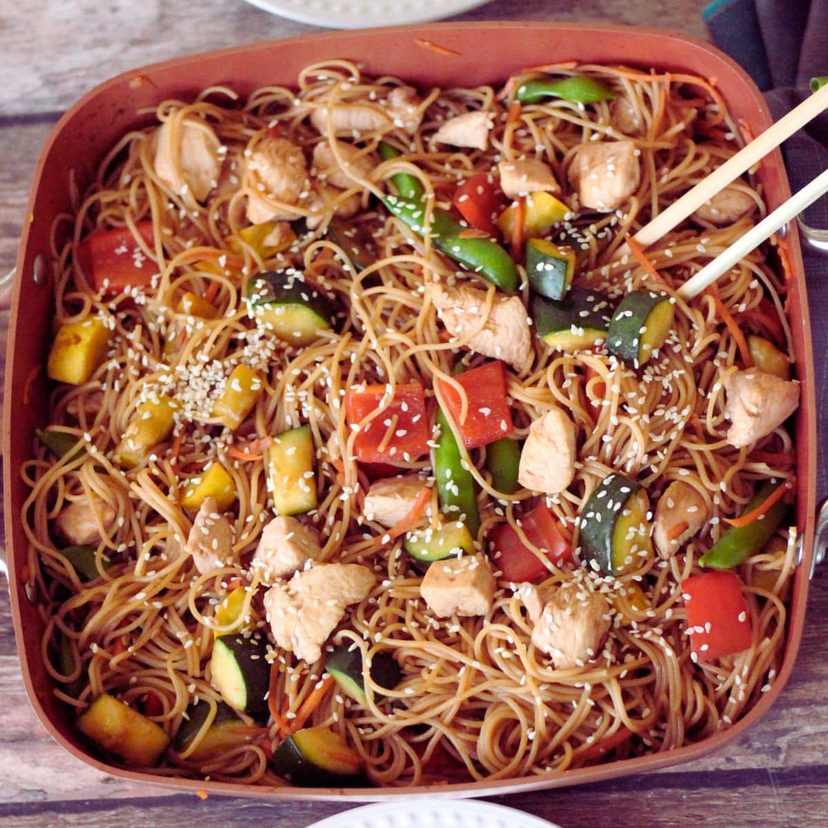spaghetti noodles with vegetables in a soy sauce sauce
