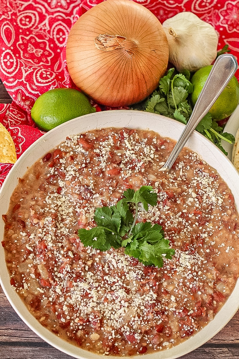 This Homemade Refried Beans recipe has just a few simple ingredients and is ready in just 10 minutes. Using canned pinto beans makes it quick and easy!!