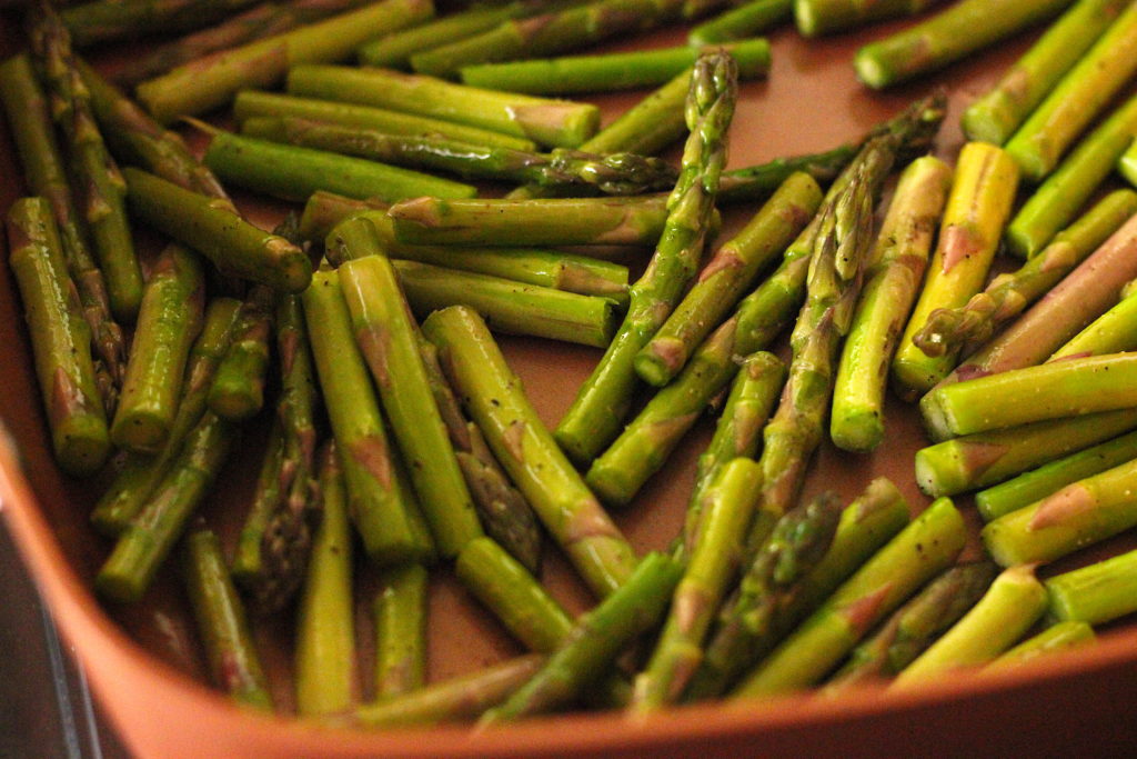 sauteed asparagus with lemon in a pan