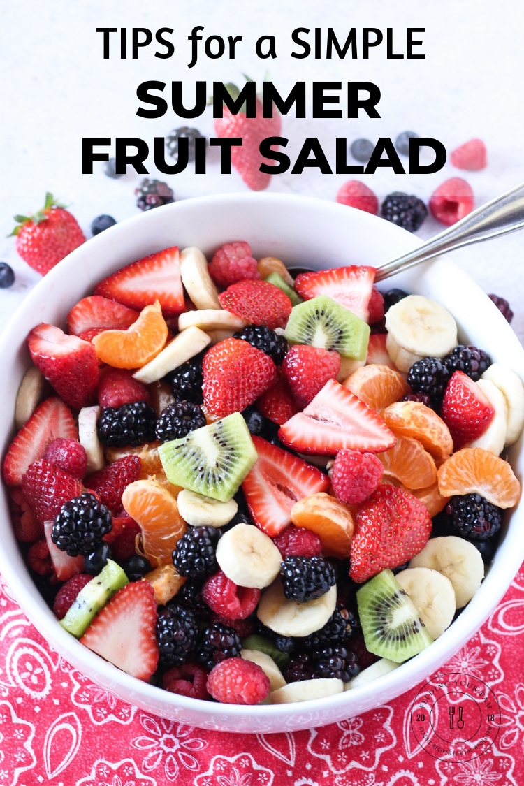 Big bowl of mixed berry fruit salad with the words "Tips for a simple summer fruit salad"