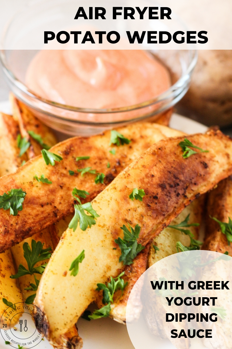 air fryer potato wedges on a plate with greek yogurt dipping sauce