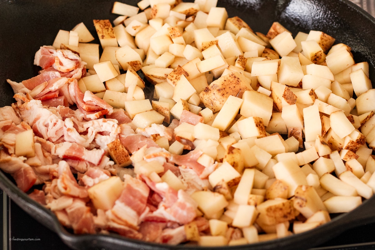 sliced potatoes and bacon in a cast iron skillet
