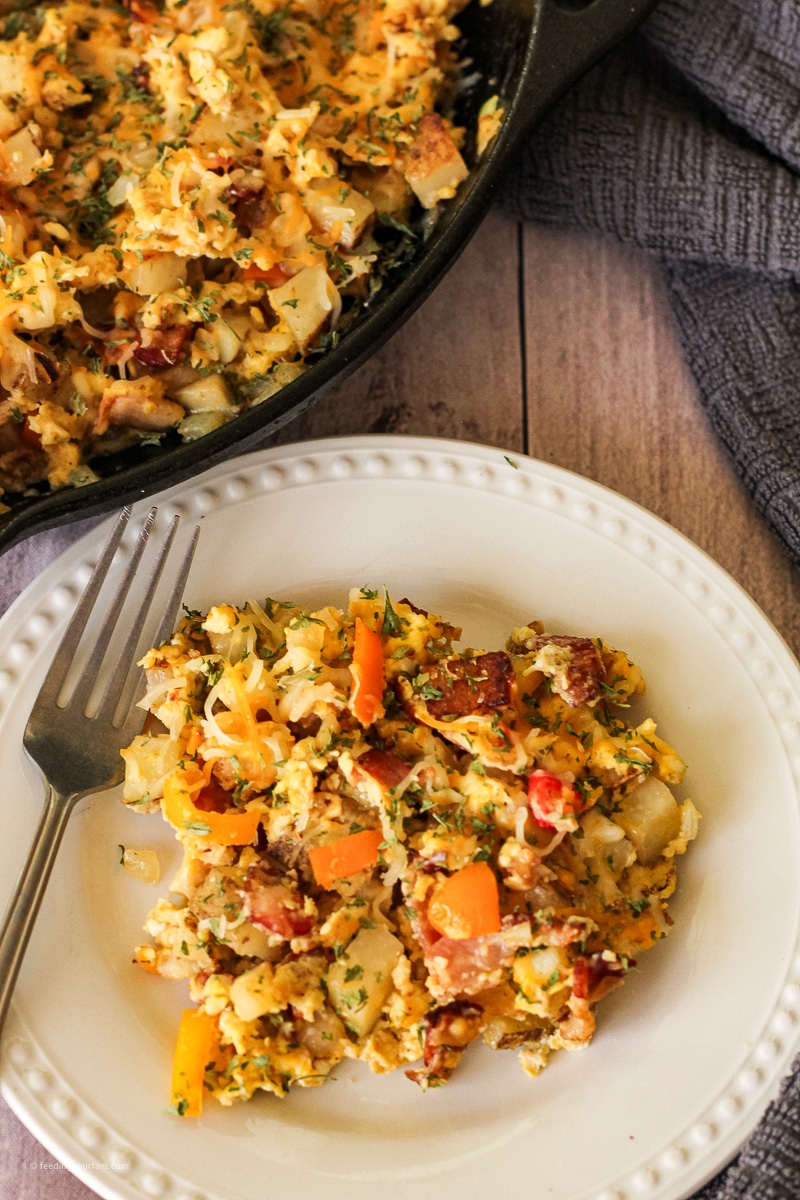 If you're looking for a quick, satisfying breakfast that the whole fam will love, this Breakfast Hash with bacon, eggs, potatoes, and cheese is a must-make! It’s loaded with crispy bacon, tender potatoes, colorful bell peppers, onions, perfectly cooked scrambled eggs, and a melty layer of cheese on top.