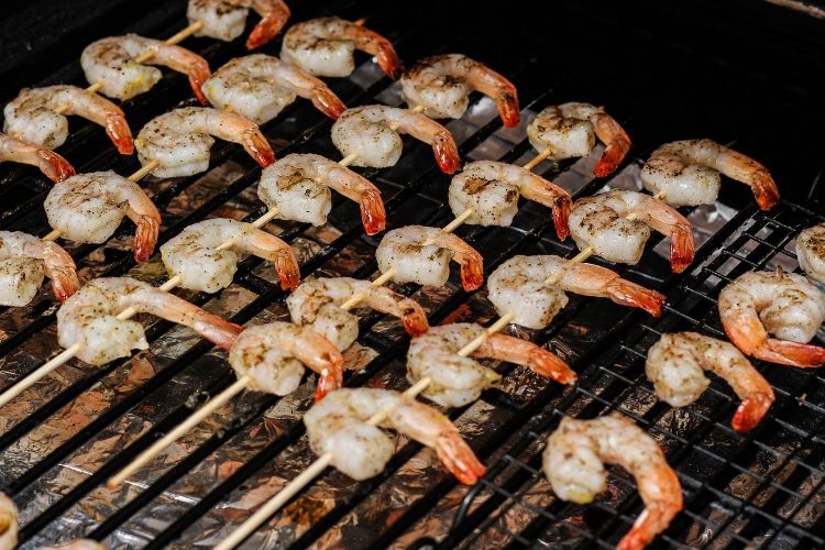 shrimp skewers on a grill
