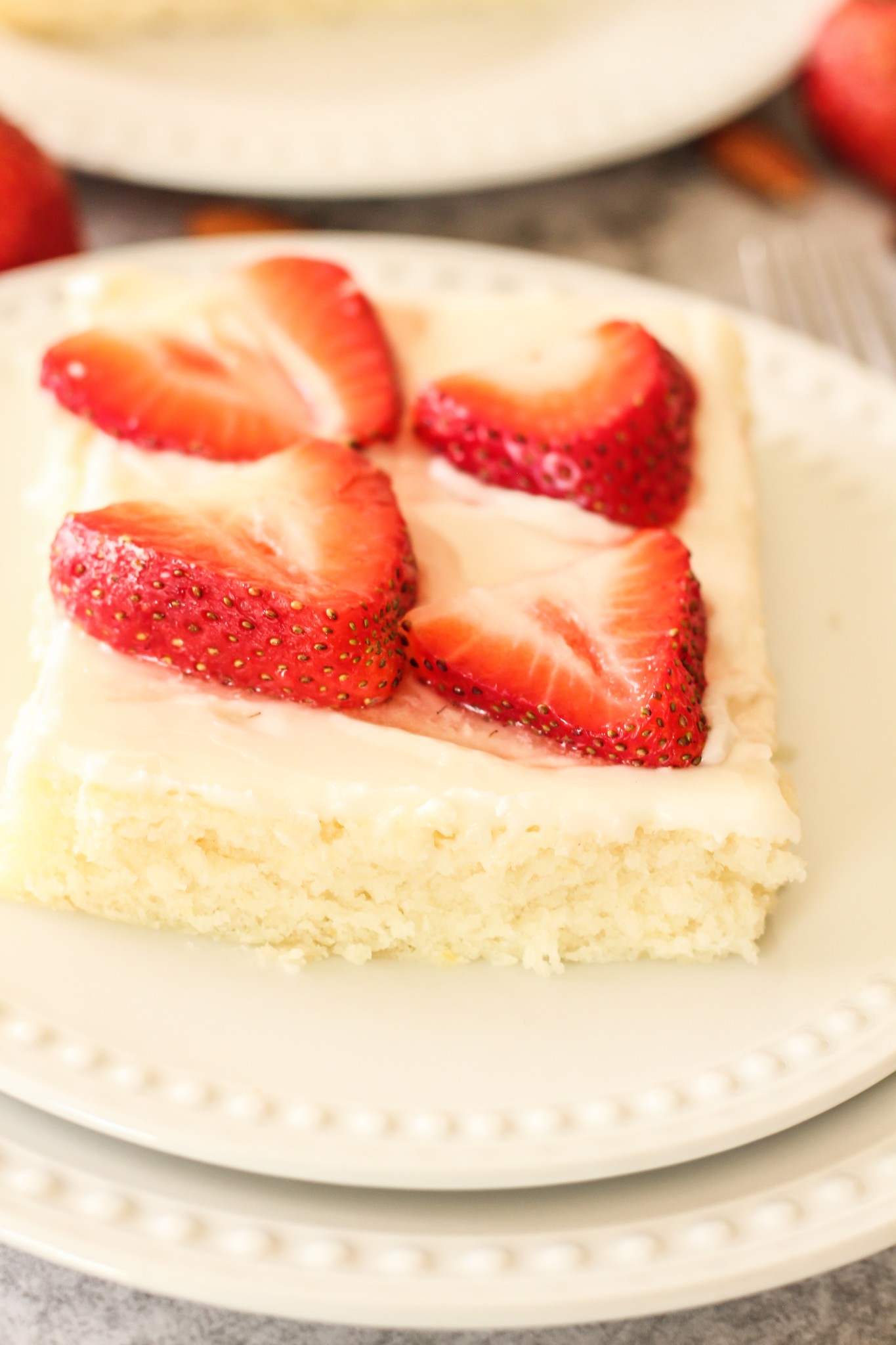 white texas sheet cake topped with strawberries