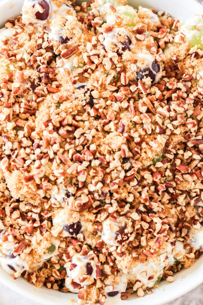 grape salad covered with pecans and brown sugar