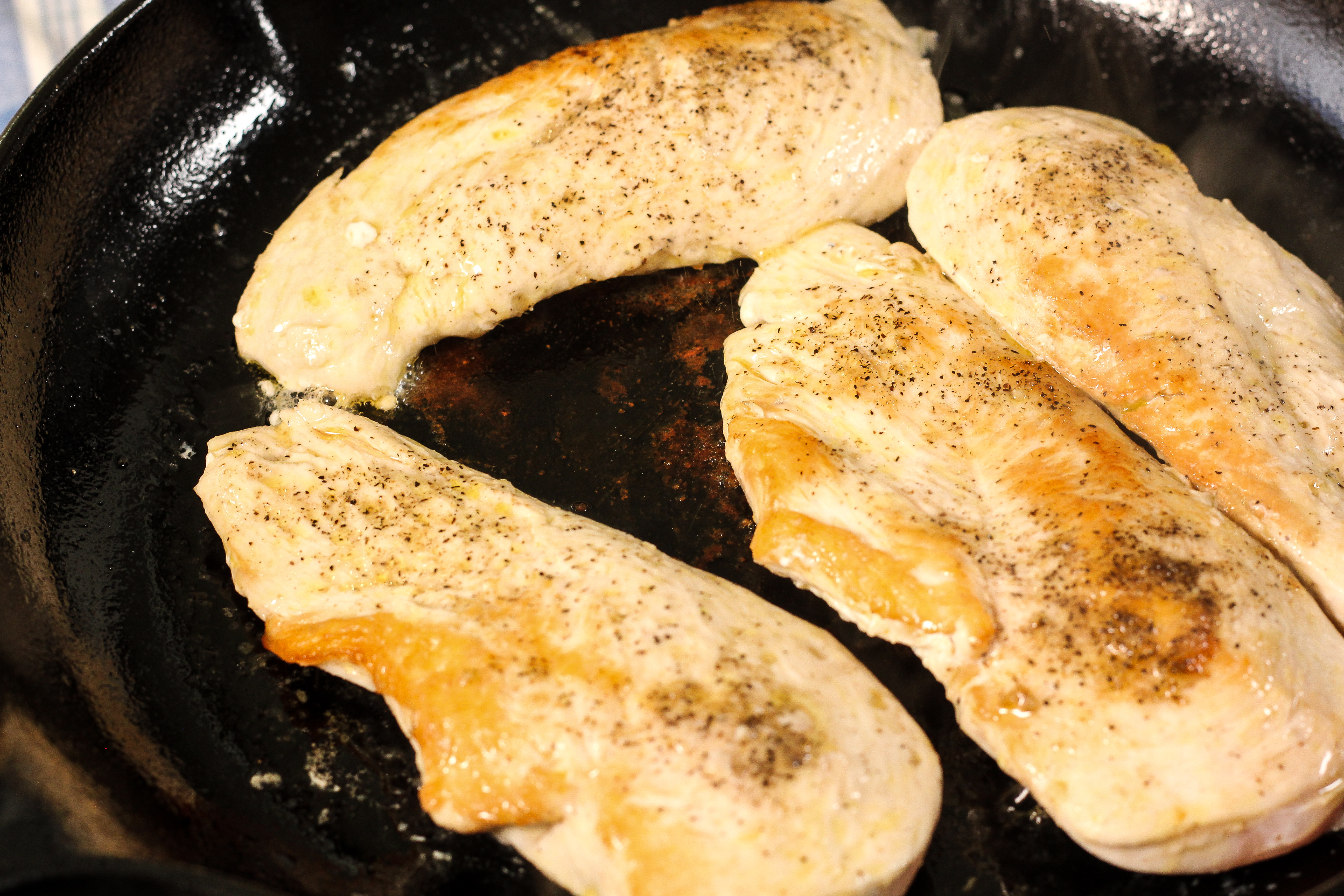 browned chicken in a cast iron