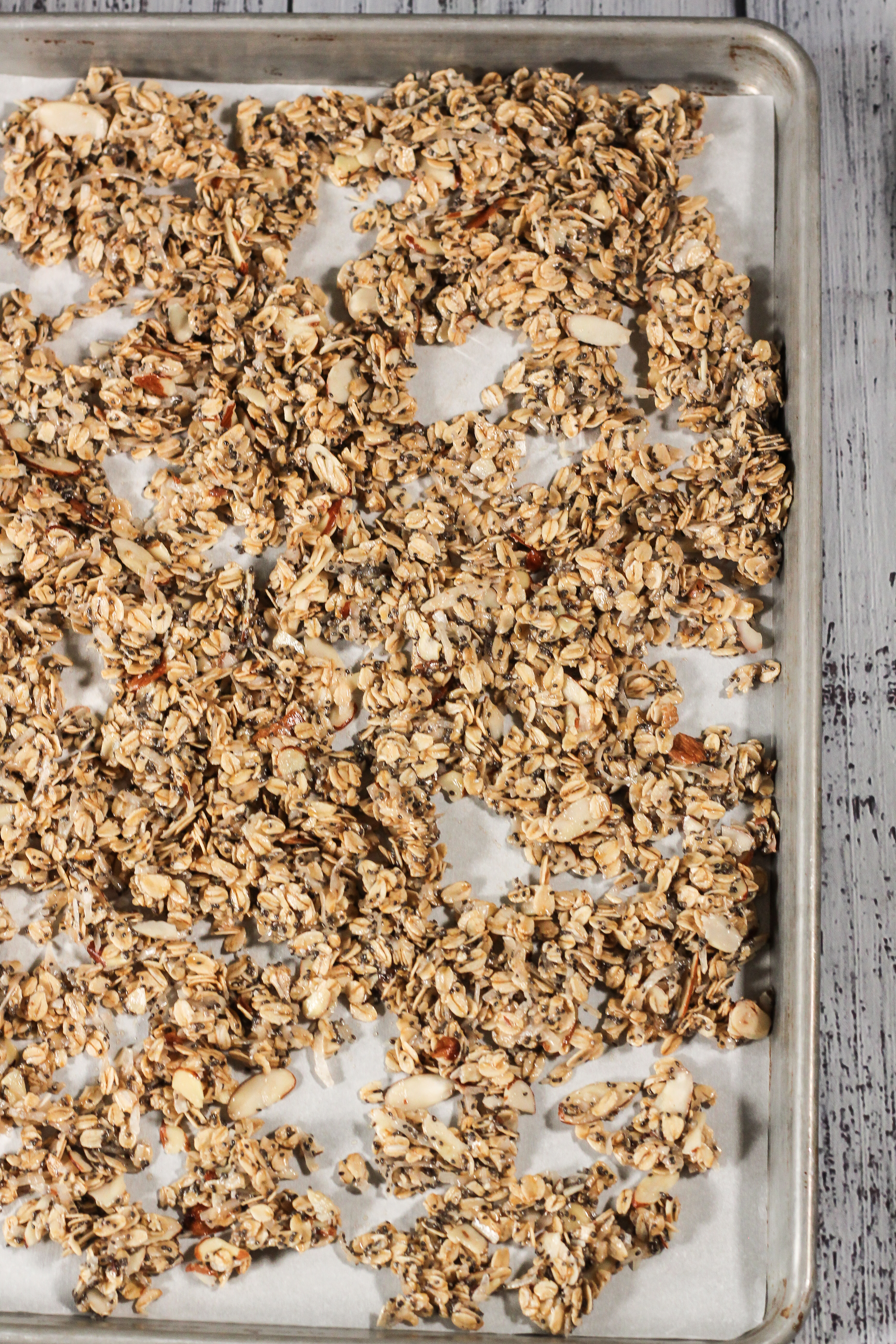 uncooked granola on a baking sheet