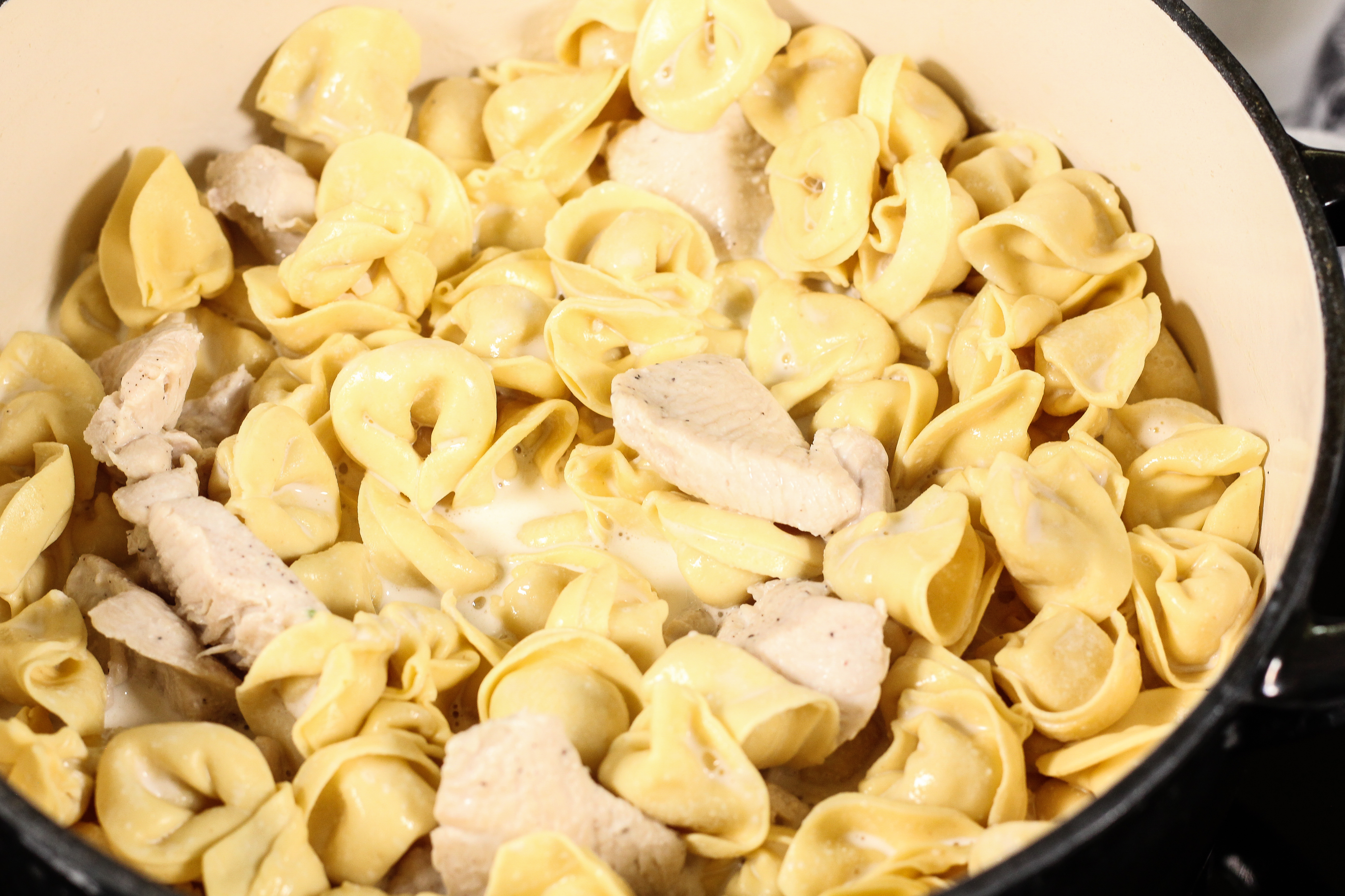 tortellini and chicken in a dutch oven pot