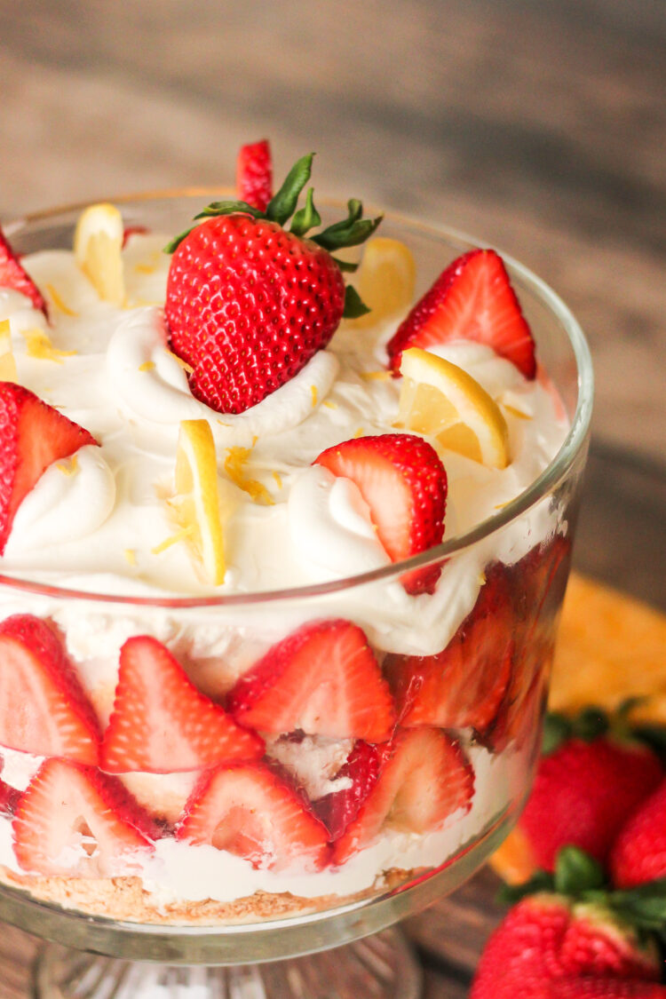 strawberry trifle with strawberry and lemon slices on top