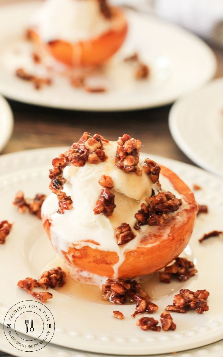 caramelized peaches topped with ice cream and toasted pecans