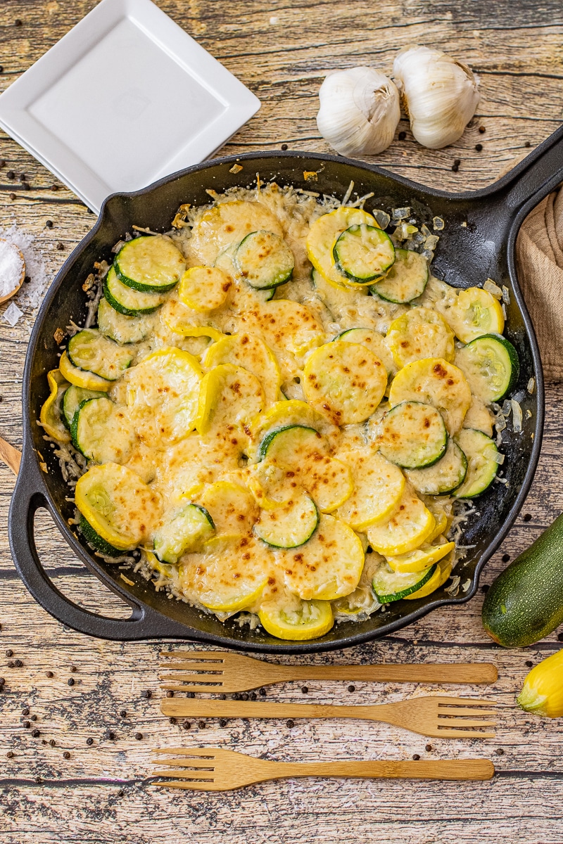 This simple Sauteed Zucchini and Yellow Squash Recipe is a perfect side dish year round. Loaded with zucchini, yellow squash, onions, garlic and topped with parmesan cheese!