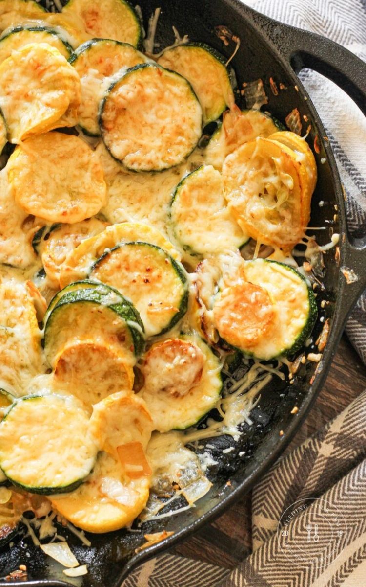 sauteed zucchini and yellow squash in a cast iron pan