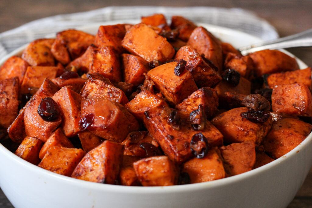 oven roasted sweet potatoes with cranberries and pecans