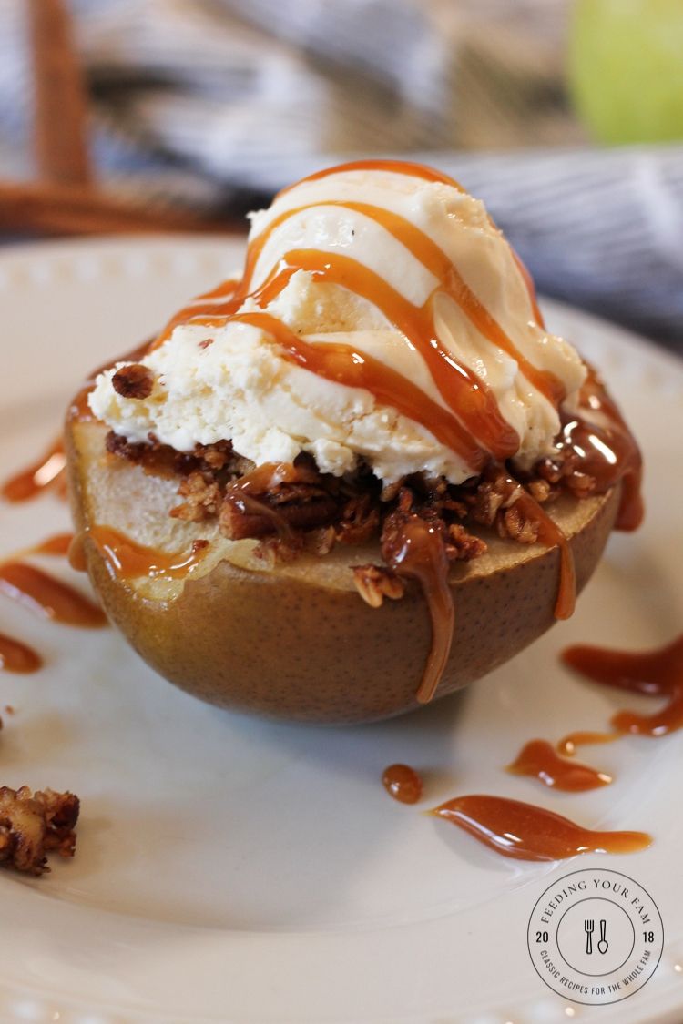 baked pear topped with ice cream and caramel