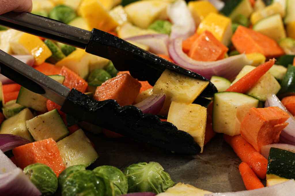 tossing roasted vegetables