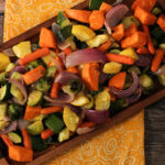 oven roasted vegetables on a wooden platter