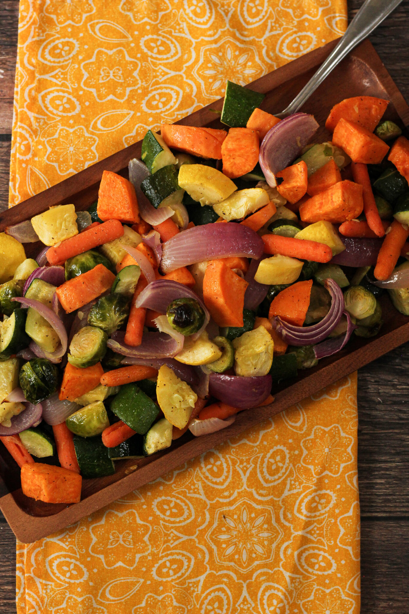 oven roasted vegetables on a wooden platter