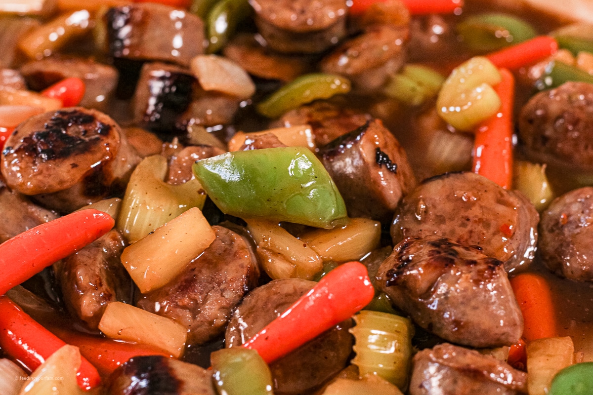 Italian sausages cooked with green peppers, carrots, onions, and pineapples in a sweet and sour sauce
