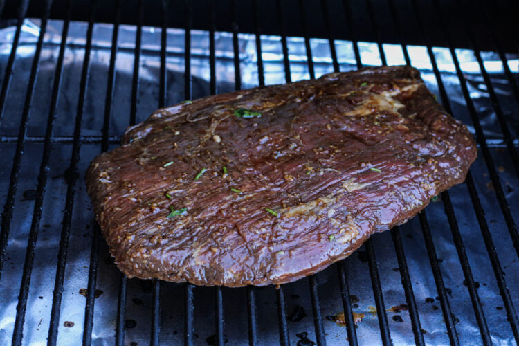 flank steak on a grill