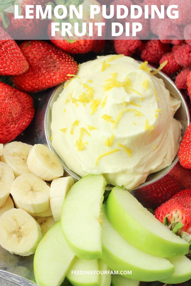 bananas, strawberries, raspberries and green apples surrounding yellow lemon fruit dip in the center