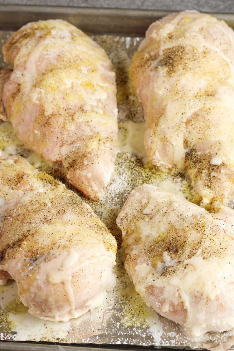 frozen chicken breast on a baking sheet 