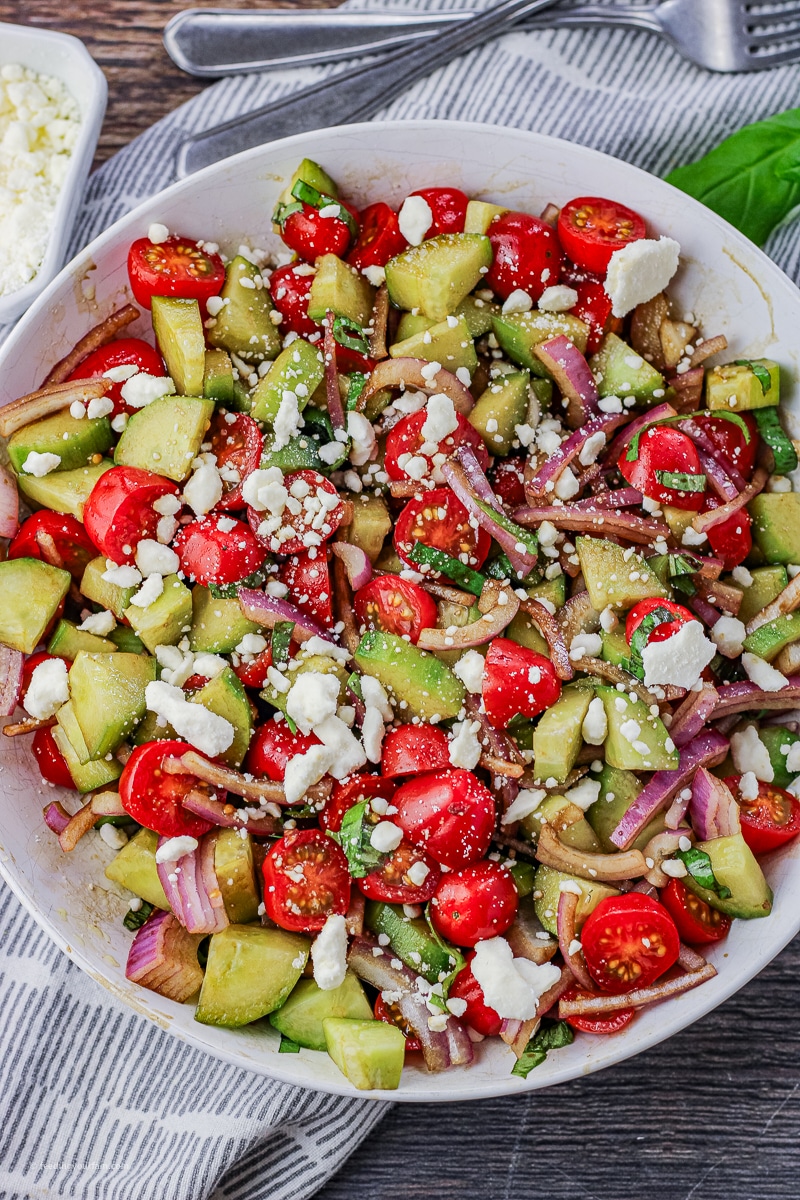 This Cucumber Tomato Feta Salad is the perfect Summer salad/side dish. So easy to make with simple, fresh ingredients.