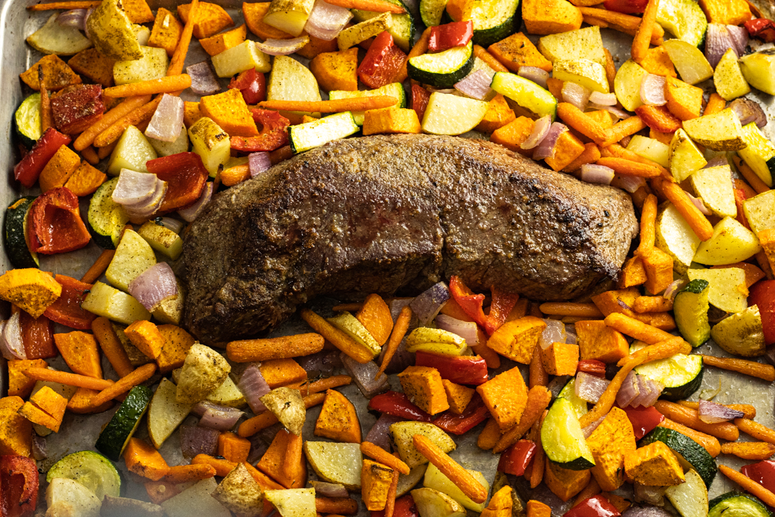 london broil in the center of roasted vegetables