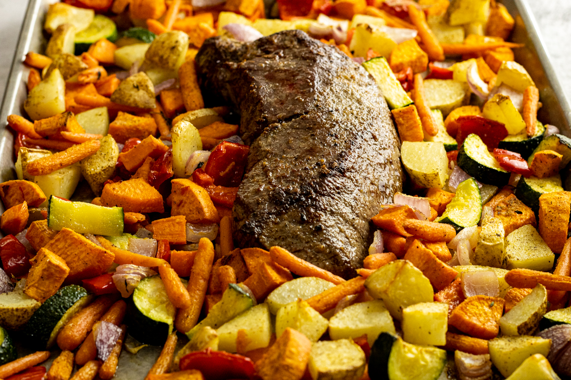 london broil in center of vegetables on a sheet pan