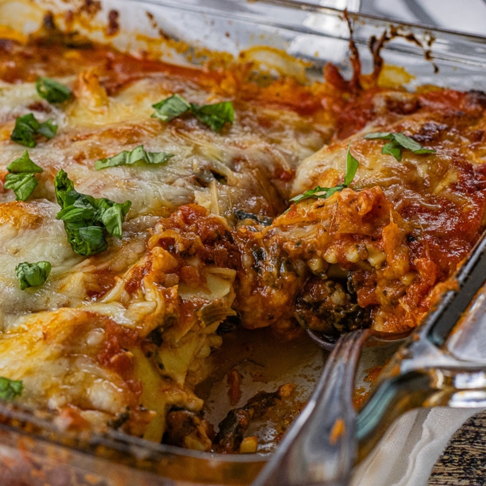 cheese lasagna made with ravioli pasta in a glass baking dish