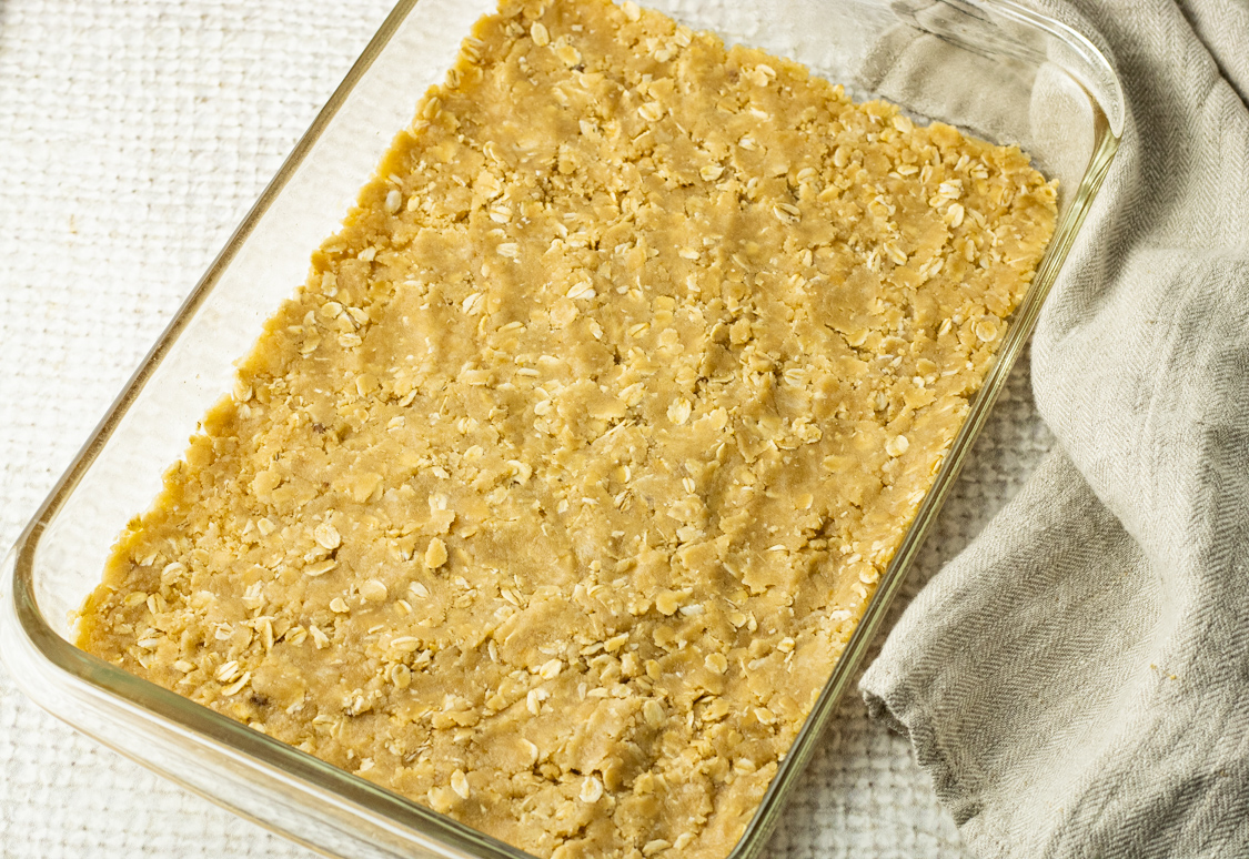 oatmeal shortbread crust pressed into bottom of a 9 x 13 inch pan