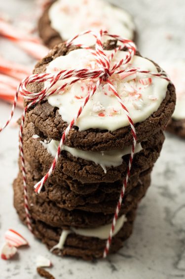 stack of chocolate cookies with white chocolate frosting