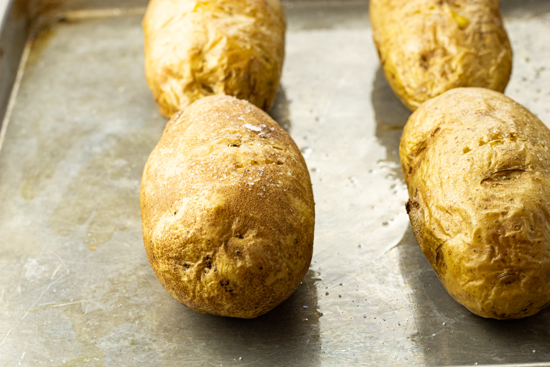 baked potatoes on a baking sheet