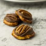 Rolo candies melted on pretzels then topped with a whole pecan