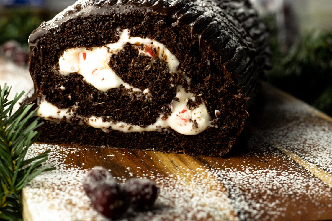 front view on yule log cake