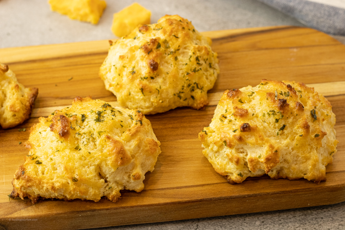 cheesy biscuits on a wooden platter