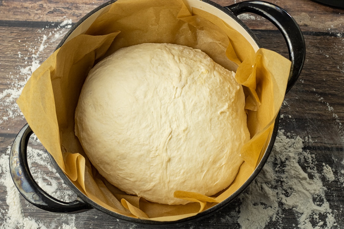 ball of bread dough in a dutch oven 