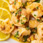 plate full of shrimp cooked in lemon and garlic