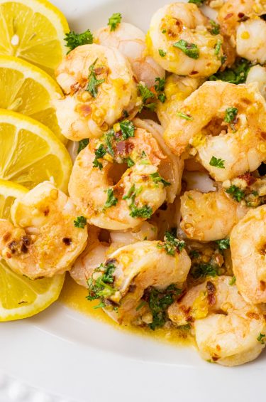 plate full of shrimp cooked in lemon and garlic