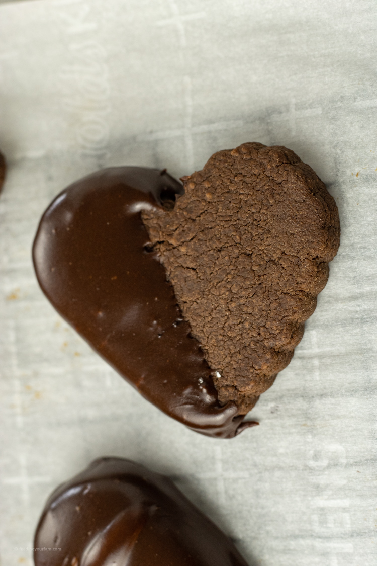 chocolate heart shaped cookie dipped half in chocolate