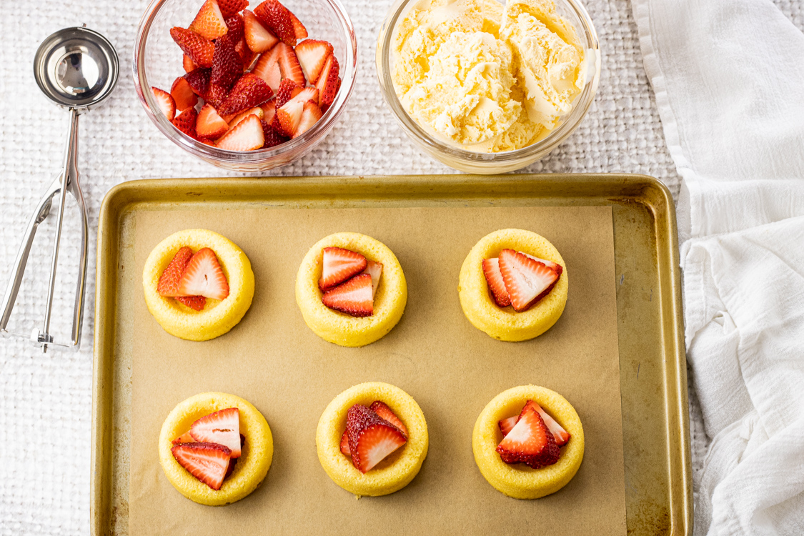 little angel food cakes topped with sliced strawberries